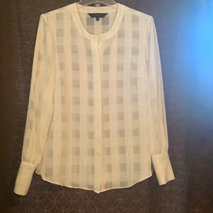 White button up blouse.